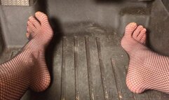 Fifi pedal pumping in sedan wearing fishnets
