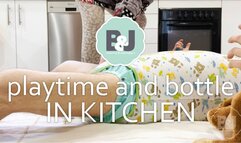 Playtime and bottle in kitchen