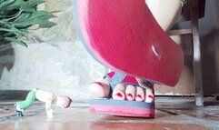 Diana Senior crushing the munequito under her sexy flip flops