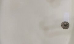 Carissa wearing the white tank top and silky pantyhose in the bathtub; a sexy show for you!