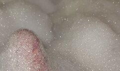 Playing with bubbles in the bathtub