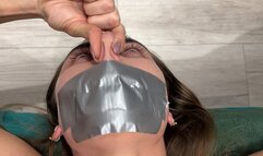Pinches nose with fingers, mouth taped shut (fragment of custom video) part 2