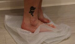 bubble wrap crush with bare feet and my new peep toe black high heel stilettos