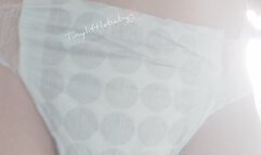 Very worn white pull up pissing