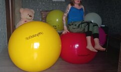 girl jumping on physio balls yellow and red