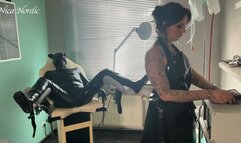 Rubber pig jerked off on the gynecological chair under current in rubber apron