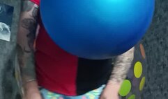 poping big blue balloon