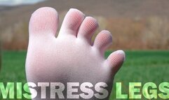 Goddess Feet in cute white socks with jeans on the spring grass field (MP4 HD)