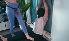 Cuffed and dominated by a strap and feet