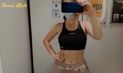 Fitting room, trying on different sweatpants and leggings