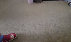 Vacuuming the floor in leggings, Birkenstock, socks