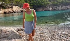 Perv girl peeing on the rock in public