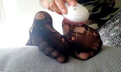Feet tickled in tights