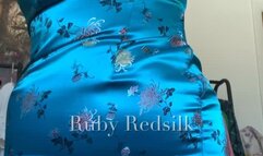 Wiggling into a tight teal cheongsam