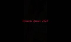 Bunions in bedroom wearing orange dress