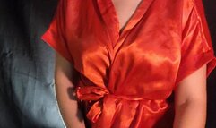 Smoking inhaling cigar wearing satin robe with all sensualidade that cigar deserves