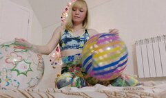 Alla rides hotly on two rare beach balls and gets real pleasure from this ride and lets all the air out of her inflatable toys!!!