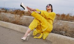 Cute girl in a pikachu costume walking down the street in high heels