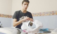 Male Looner Blowing Up an Inflatable feather and Riding it