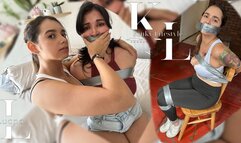 Luana Wanted to Steal Simona's Evidence (Duct Tape Bound & Gagged, Jean Shorts, Leggings, Tanktop, Sneakers, Chair Taped)