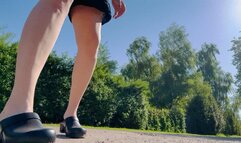 Smoking in the park in clogs