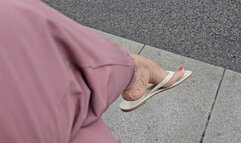 Milah Arches dangling in flip flops in la Gran Via de Madrid