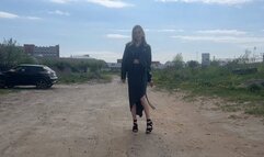 girl in high heels found a mattress and wants to tear it up with her heels, changing her shoes for thisG