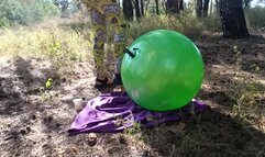 Blowing with feet pump ball in forest