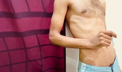 Shirtless in my room alone standing against the wall, restless, breathing heavily while smoking