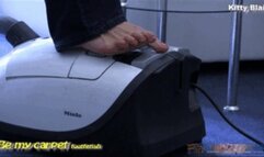 Kitty Blair barefoot in blue jeans vacuuming daily session