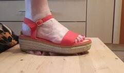 Stomping face in red sandals and barefoot (facebox)