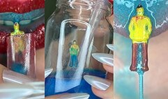 Tiny got trapped in a glass with blue liquid