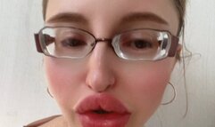 Girl in Big Huge Eye Glasses is telling her life story about her worries and difficulties in life story in Russian language