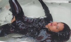 In the bathtub dressed in latex