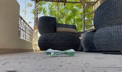 Crushing filled plastic bottle with dirty feet and my butt