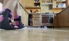 Topless with double ankle braces in the kitchen