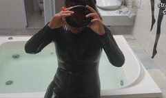 Snorkel gear and latex clothing in bathtub