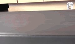 Leather upholstery and slaves hand under High Heels