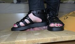 Stomping face in black sandals and barefoot (facebox)