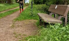 Hot Girl with red Hunter and Latexleggings at the Forrest with Kneeorthesis