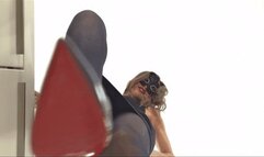 Trampling your face into a pulp under my high heels!
