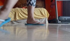 Dirty feet in flip flops leggings housecleaning