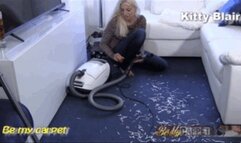 Kitty Blair vacuuming paper stripes close up